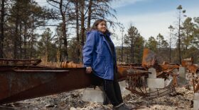 Meg Sandoval at the site of her former mobile home on her family’s ranch in Rociada, New Mexico, which was ravaged by the Hermits Peak-Calf Canyon Fire. Until recently, she was too traumatized to visit the property.