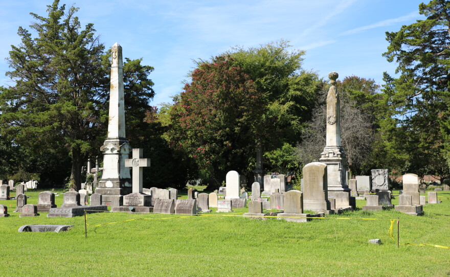Yellow caution tape marks off a recently restored section of gravestones at Norfolk's Elmwood Cemetery in September 2026.