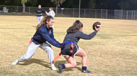 Maci Joncich, left, attempts to pull the flag of a teammate during practice for the UF Women’s Club Flag Football team on Monday, Jan. 26, 2026.