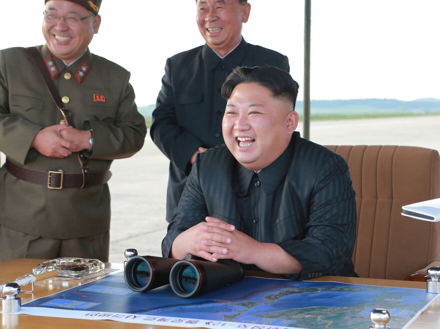 An undated picture released by North Korea's official Korean Central News Agency on Sept. 16 shows North Korean leader Kim Jong Un inspecting a launching drill of the Hwasong-12 ballistic missile at an undisclosed location. Kim vowed to complete North Korea's nuclear force despite sanctions, state media reported.