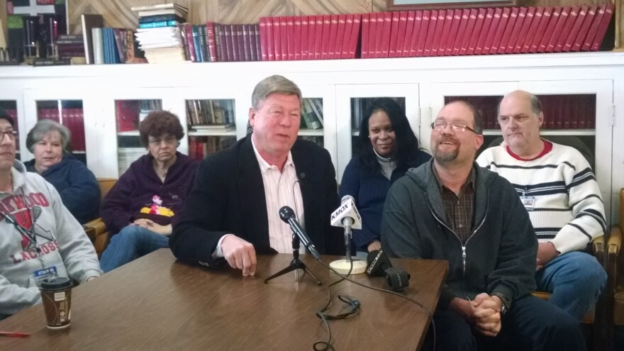 New Life Evangelistic Center director Larry Rice (center) said the emergency homeless shelter will seek an injunction against a city deadline to reduce its overnight beds.