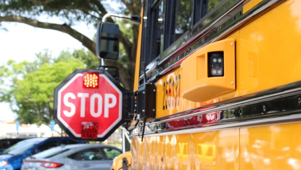 close up of safety camera on school bus with stop sign