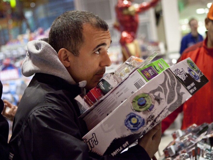 A holiday shopper at the Toys R Us in New York's Times Square.