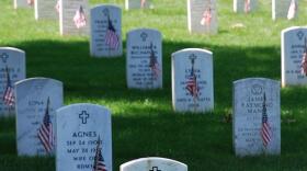 The Arlington National Cemetery showing the tradition of honoring grave stones of veterans with the American flag on Memorial Day. CREDIT WIKIMEDIA COMMONS