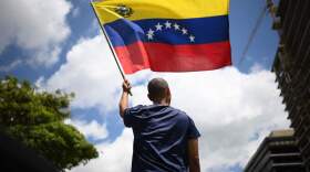 A man waves a Venezuelan flag during a protest in Caracas on August 17, 2024. (Federico Parra/AFP via Getty Images)