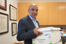 Gopal Balachandran is the lead attorney for Subramanyam "Subu" Vedam and an Associate Professor of Clinical Law at Penn State Dickinson Law, where he directs the Criminal Appellate & Post-Conviction Services Clinic. In this photo, he's holding one of five boxes containing documents in the Vedam case. Balachandran said he has always been interested in the case as a fellow Indian-American and wanted to correct the injustice of Vedam's second trial, in which the prosecutor asked questions about his ethnicity and religion. 