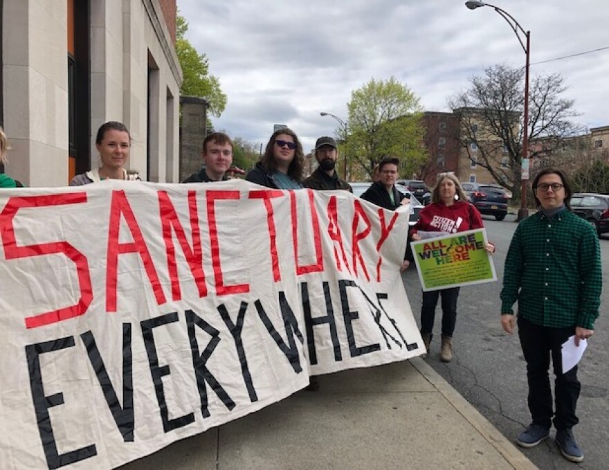 Members of Green Light NY demonstrate in support of driver's licenses for undocumented immigrants at the Rensselaer County DMV in Troy on Wednesday.