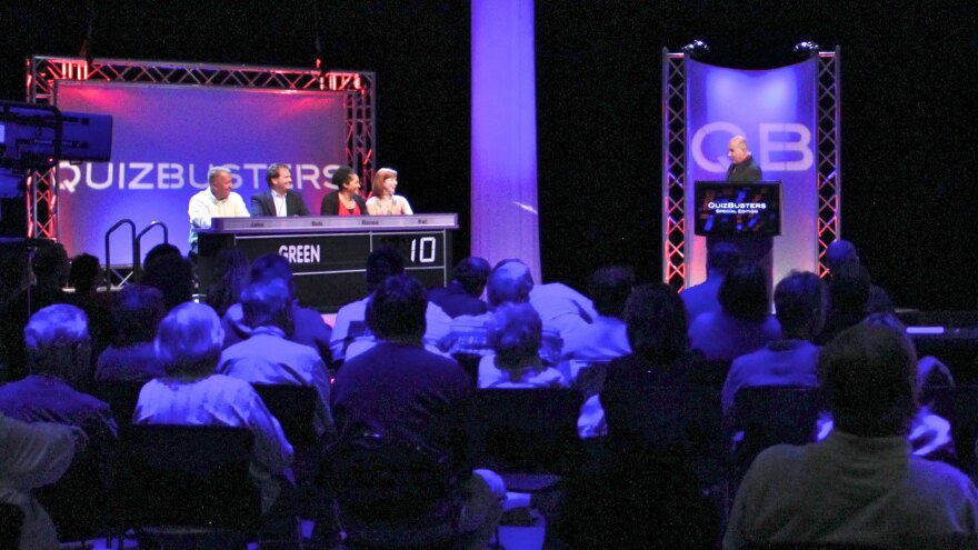 host, panelists and audience in studio