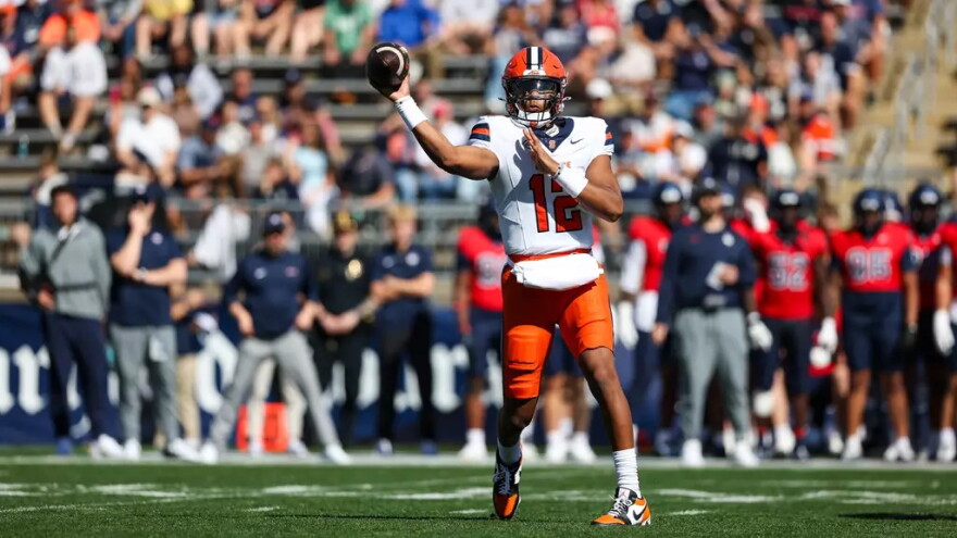 Amari Odom (12, White) attempts a pass against Connecticut.