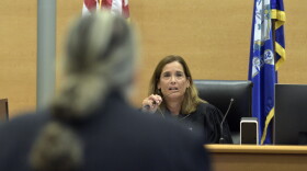 Connecticut Superior Court Judge Barbara Bellis listens to Norman Pattis, attorney for conspiracy theorist Alex Jones, during Jones' trial at Waterbury Superior Court, Tuesday morning, Sept. 13, 2022, in Waterbury, Conn. A Connecticut jury has begun hearing arguments about how much money Jones should pay relatives of victims of the Sandy Hook Elementary School shooting for calling the massacre a hoax. (H John Voorhees II/Hearst Connecticut Media via AP, Pool)