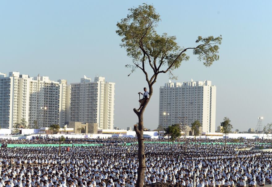 RSS members listen to RSS leader Mohan Bhagwat speak at a rally in Pune in 2016.