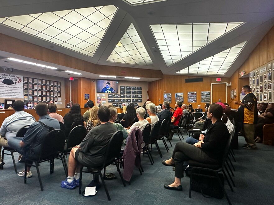 People gather to voice concerns at the Alachua County School Board meeting in Gainesville, Fla., Tuesday night, Oct. 7, 2025. (Jessica Wilkinson/WUFT News)