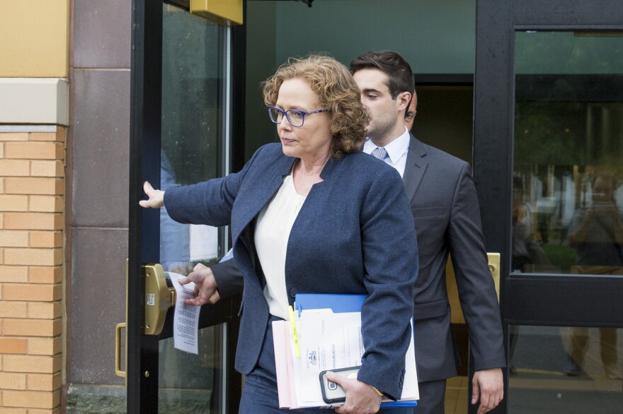 Karen Muir, front, Becker's attorney, walked out of the Centre County Courthouse on Thursday, after the jury rendered a verdict for Becker.