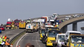 Recovery workers vehicles back the front of the Sheppey crossing bridge after 100 or more vehicles were involved in a major road traffic incident in Sheppey, Kent, southeast England on Thursday.