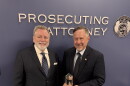 Platte County prosecutor Eric Zahnd, left, receives the Distinguished Prosecutor Award from the National District Attorneys Association in 2025. 