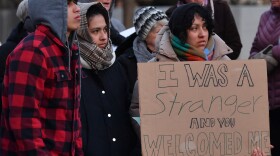 In the Gospel of Matthew, Jesus says "I was a stranger and you welcomed me.” Those who attended the prayer vigil for immigrants and refugees in Scranton carried signs with that message.