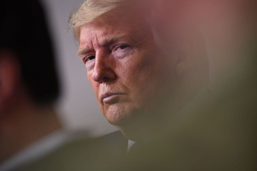 President Trump listens to Vice President Mike Pence speak during an unscheduled briefing after a Coronavirus Task Force meeting at the White House on April 5, 2020, in Washington, DC. (Photo by Eric Baradat/AFP/Getty Images)