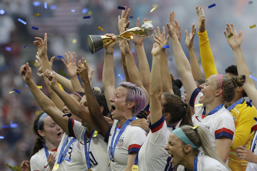 United States' Megan Rapinoe holds the trophy after winning the Women's World Cup final soccer match between US and The Netherlands at the Stade de Lyon in Decines, outside Lyon, France, Sunday, July 7, 2019.