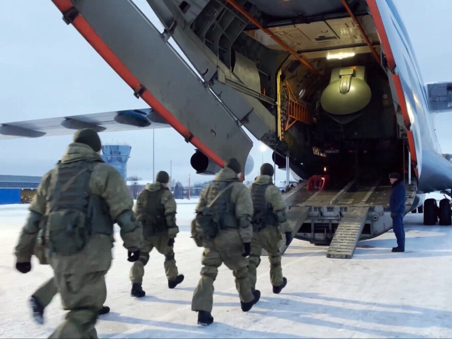 In this photo taken from video released by the Russian Defense Ministry Press Service, Russian peacekeepers board on a Russian military plane at an airfield outside Moscow, in Russia to fly to Kazakhstan Thursday. A Russia-led military alliance, the Collective Security Treaty Organization, said early Thursday that it would send peacekeeper troops to Kazakhstan.