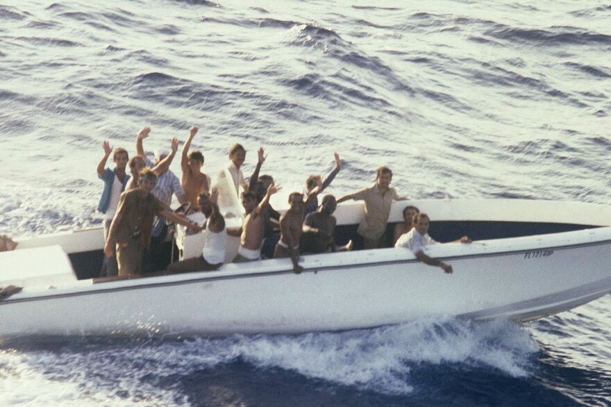 Refugees aboard a vessel in the small port of Mariel, Cuba, on April 23, 1980, wait to sail to the U.S. Fidel Castro agreed to let them leave the island for Florida in what became known as the Mariel boatlift. More than 100,000 Cubans made it to the U.S. The new arrivals included many thousands released from Cuba's prisons and mental institutions, leading to a tightening of the U.S. embargo.