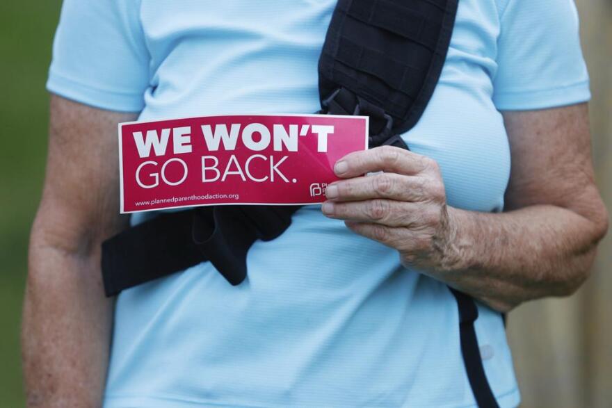 Protesters display their signs on Friday, June 24, 2022, at North Straub Park in St. Petersburg, Fla. The Supreme Court on Friday stripped away women’s constitutional protections for abortion, a fundamental and deeply personal change for Americans' lives after nearly a half-century under Roe v. Wade. The court’s overturning of the landmark court ruling is likely to lead to abortion bans in roughly half the states.