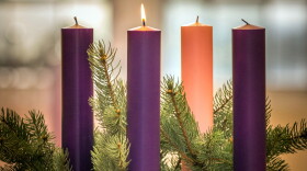 A lit candle is seen on an Advent wreath. Advent, a season of joyful expectation before Christmas, begins Dec. 2 this year. The Advent wreath, with a candle marking each week of the season, is a traditional symbol of the liturgical period. (CNS photo/Lisa Johnston, St Louis Review) See FAITH-ALIVE 42 Oct. 25, 2018.