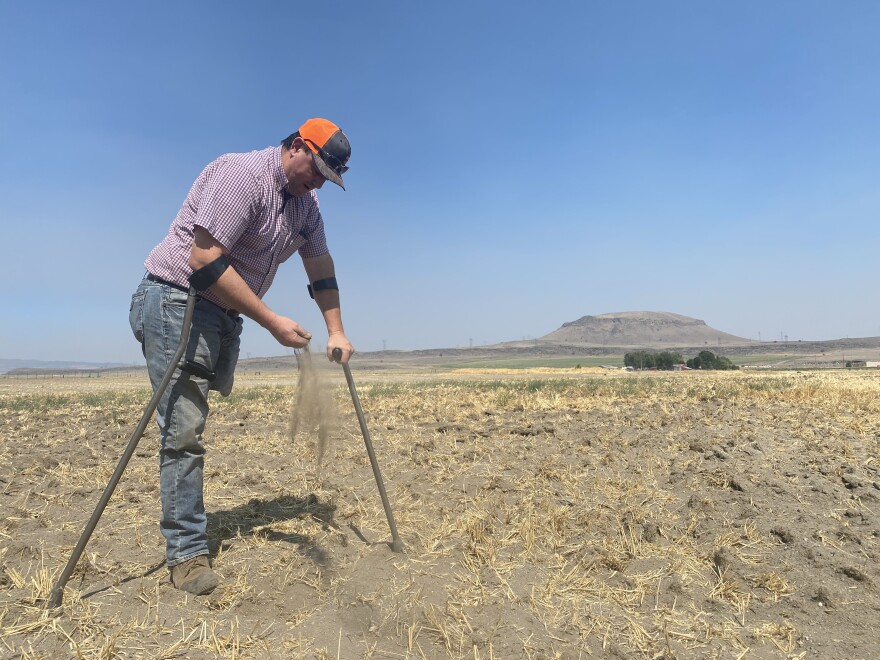 Ben DuVal, president of the Klamath Water Users Association, sifts the soil in one of his dry fields near his Tulelake home that was first owned by his grandfather.