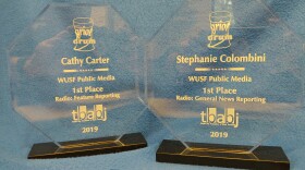 WUSF reporter Cathy Carter won the Best Feature Reporting Award while Stephanie Colombini won the Best General Reporting Award. 