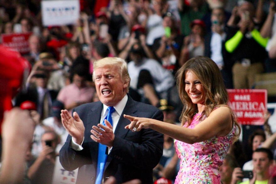 President Donald Trump and First Lady Melania Trump enter the stage to give their speeches at the Covelli Centre in Youngstown, Ohio, July 25, 2017. 