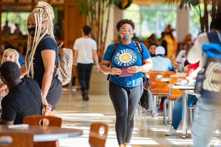 Ball State students eat and talk in a dining hall during the first week of classes.