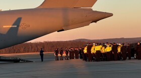 Representatives from the Pittsfield, Massachusetts, police and fire department salute toward the casket holding the remains of Jacob Galliher, a U.S. Air Force staff sergeant who died during a training exercise. Galliher grew up in Pittsfield.