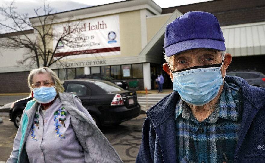 Richard Burke, 90, and his wife, June, 86, leave a COVID-19 vaccination site operated by Maine Health in a site of a former department store, Wednesday, March 3, 2021, in Sanford, Maine.