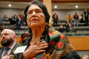 Dolores Huerta, the Mexican-American social activist who formed a farm workers union with Cesar Chavez, stands for the Pledge of Allegiance in Spanish while visiting the New Mexico Statehouse in Santa Fe. N.M., on Feb. 27, 2019.