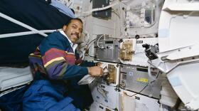 Astronaut Bernard A. Harris, Jr., a physician and payload commander, monitors several Spacehab-3 experiments which occupy locker space on the Space Shuttle Discovery's mid-deck. The Spacehab 3 Module is located in the cargo bay. Others onboard the Discovery were astronauts James D. Wetherbee, commander; Eileen M. Collins, pilot; mission specialists C. Michael Foale, Janice E. Voss, and Russian cosmonaut Vladimir G. Titov.