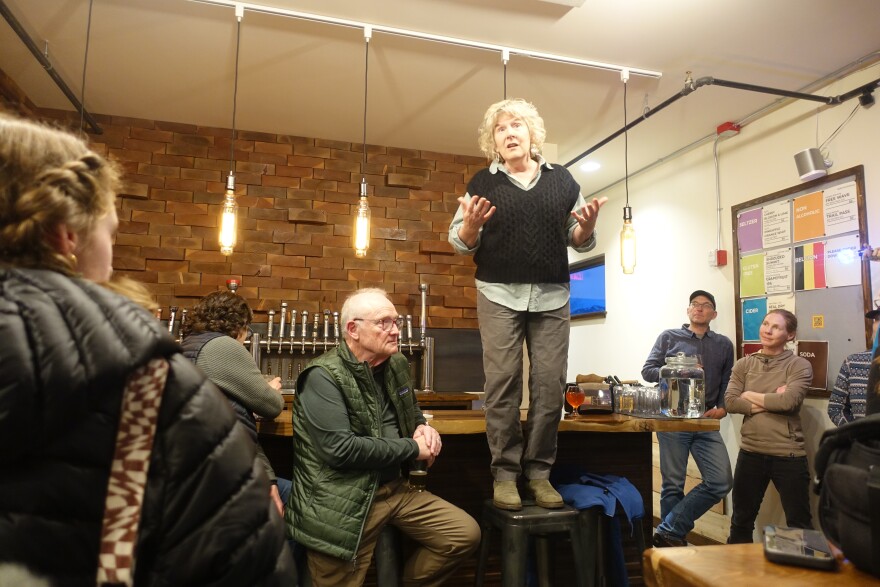 Retired Custer Gallatin National Forest, Forest Supervisor, Mary Erikson speaks at a meeting of recently laid off workers and supporters
