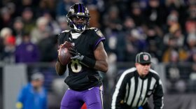 Ravens quarterback Lamar Jackson drops back to pass in the second quarter against the New England Patriots in Week 16. (Ulysses Muñoz/The Banner)