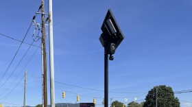 An automatic license plate reader looks over westbound traffic on Tunnel Road near Asheville Mall in east Asheville.