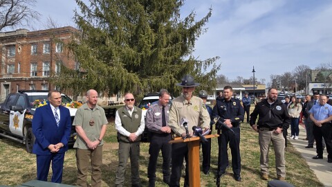 Sheriff Brad Cole (center) is flanked by regional sheriffs and Missouri Highway Patrol staff and Gov. Mike Kehoe (far left)