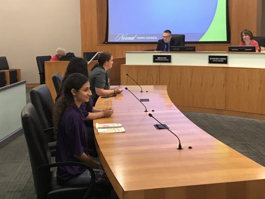 Two girls speak to the Normal Town Council