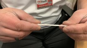 Tiny test strips are being used by some drug users to determine if there is fentanyl mixed in with their drugs ELLEN ABBOTT / WRVO NEWS