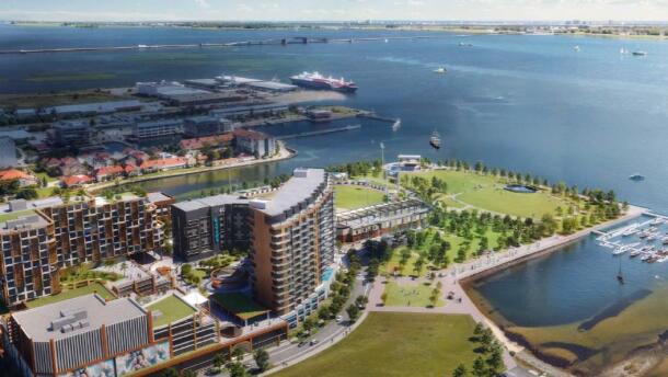 Aerial rendering of Pensacola’s Community Maritime Park showing proposed mixed-use development with multi-story buildings, public green space, marina, and waterfront views of Pensacola Bay.