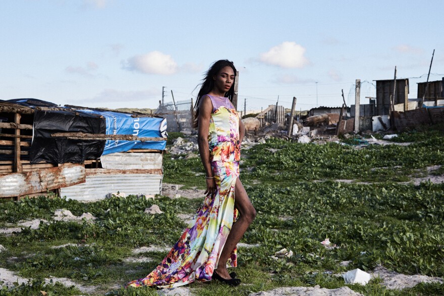 Shakira Mabika, 24, emigrated to South Africa from Zimbabwe, where the former president "has referred to people like me as 'pigs' and un-African." She asked to be photographed by dilapidated shacks where pigs were kept behind a fence. "I moved to Cape Town in search for a space where I could live my truth," she says. But she says she has faced transphobia and still hasn't found a job.