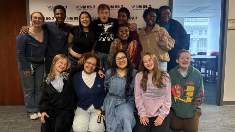 Rufus King High School’s a cappella group, King’s Chord, poses for a group photo at WUWM.