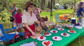 One of last year's Feastival Judges, Laura Nicole Floyd, samples the various entrees for the most delicious tomato competition.