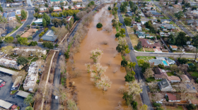 An aerial shot of Bear Creek in Merced is shown after heavy rains in January 2023 resulted in water flooding into residential areas.