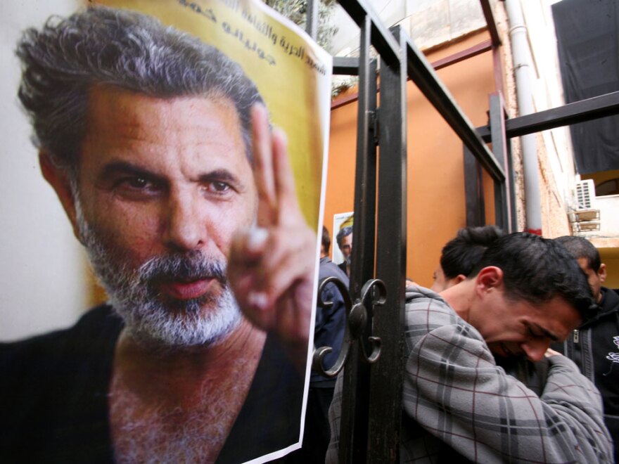 Palestinian youths mourn the death of Juliano Mer Khamis outside the Freedom Theatre in Jenin refugee camp in the West Bank on Apr. 5.