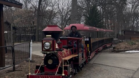 Jaquan Redmond, guest experience supervisor at the Potawatomi Zoo, on Wednesday shows a reporter the zoo's new train.