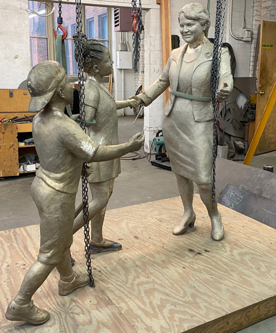 The statue, shown here at about 90% complete, portrays Spencer when she was vice-mayor in 1983-84. Tsuchiya says the overall motif is Juncta Juvant, the city's motto.