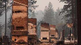 Chimneys are the only structures remaining in a residential neighborhood after a wildfire hit the northern part of Spokane, Wash., Monday, Aug. 3, 2026. (Lindsey Wasson/AP)