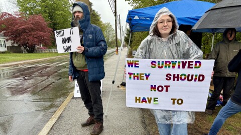 Frank Staples, of Manchester, and Michaela Jancsy, of Rochester, spent time in the state's youth detention center as teenagers. They protested outside the center Saturday as the state investigates alleged abuse and neglect of youth there now.